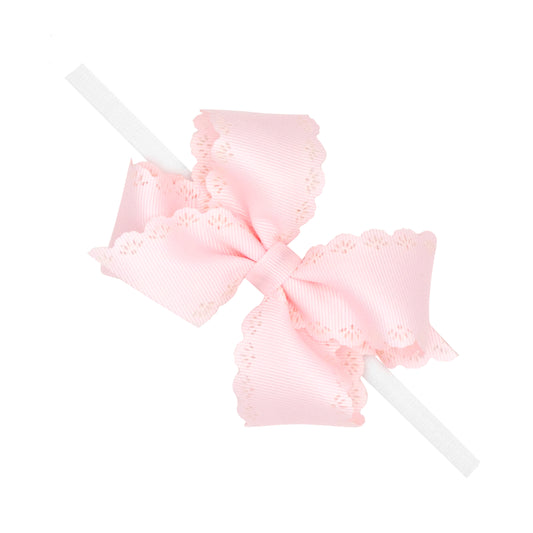 Small Grosgrain Hair Bow with Embossed Eyelet Edge on White Nylon Band - Powder Pink